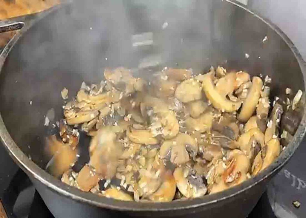 Sauteing the mushrooms for the chicken madeira recipe