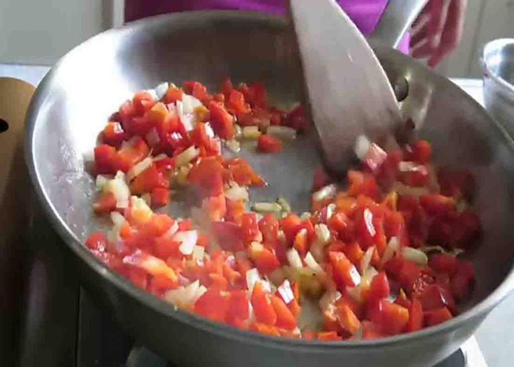 Sauteing the onion and bell peppers for the spinach egg casserole