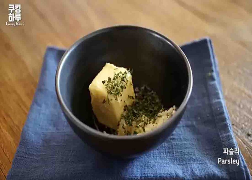 Combining the ingredients for the garlic spread