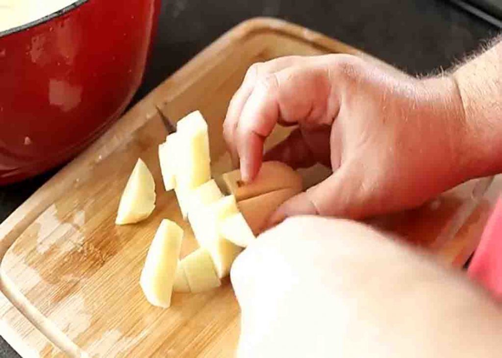 Chopping the potatoes for the potato salad recipe