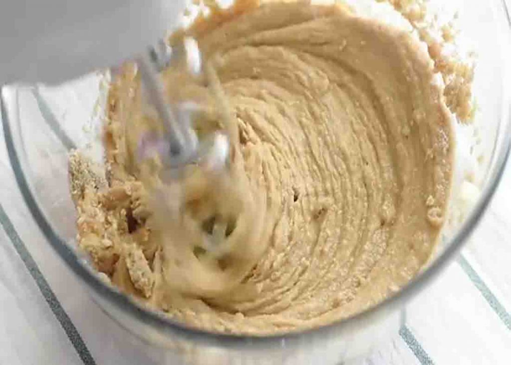 Mixing the peanut butter blossom cookies dough