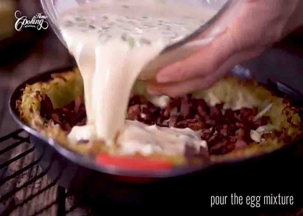 Assembling the potato crust quiche in the pan