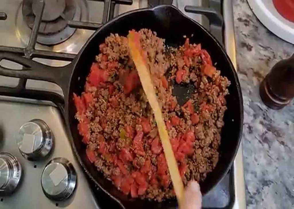 Cooking the ground beef for the hashbrown casserole recipe