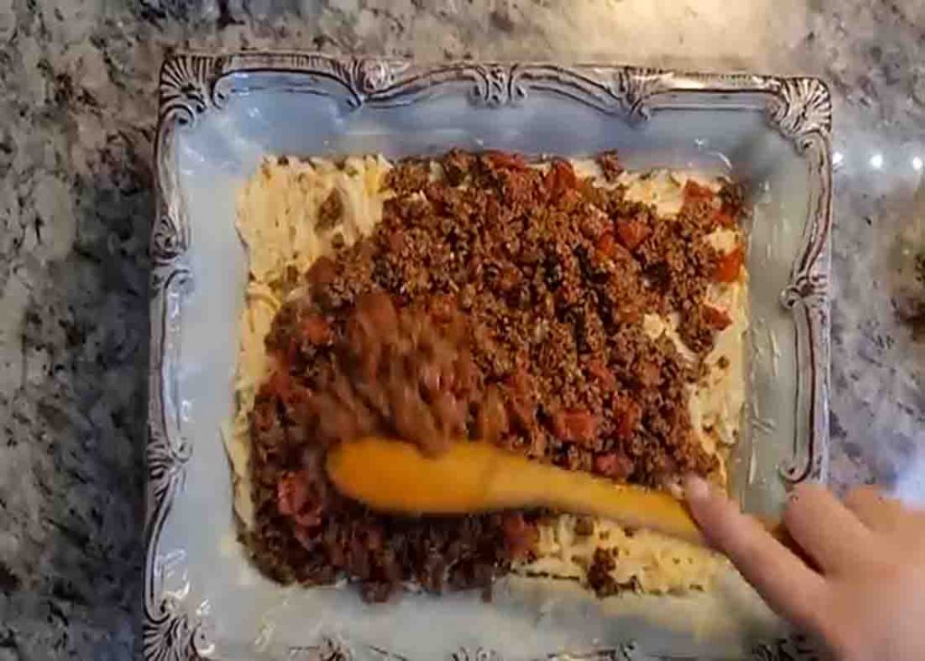 Assembling the hashbrown casserole