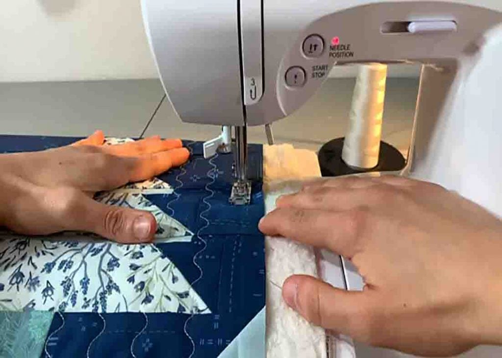 Joining quilt-as-you-blocks with stitch in the ditch method