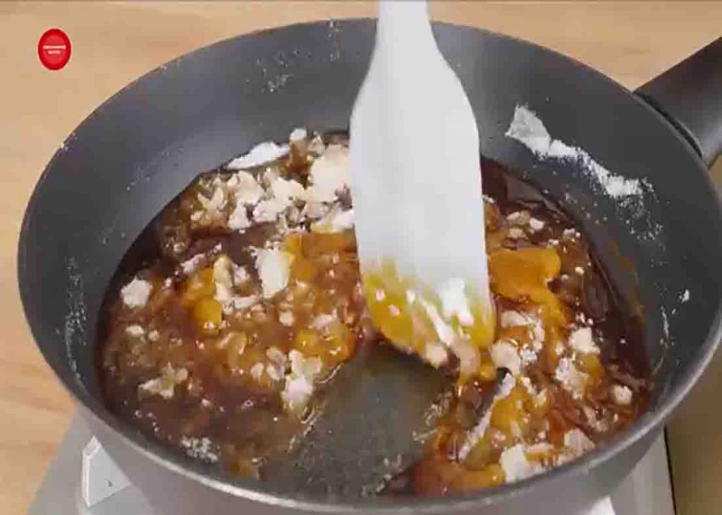 Caramelizing the sugar for the meringue cake