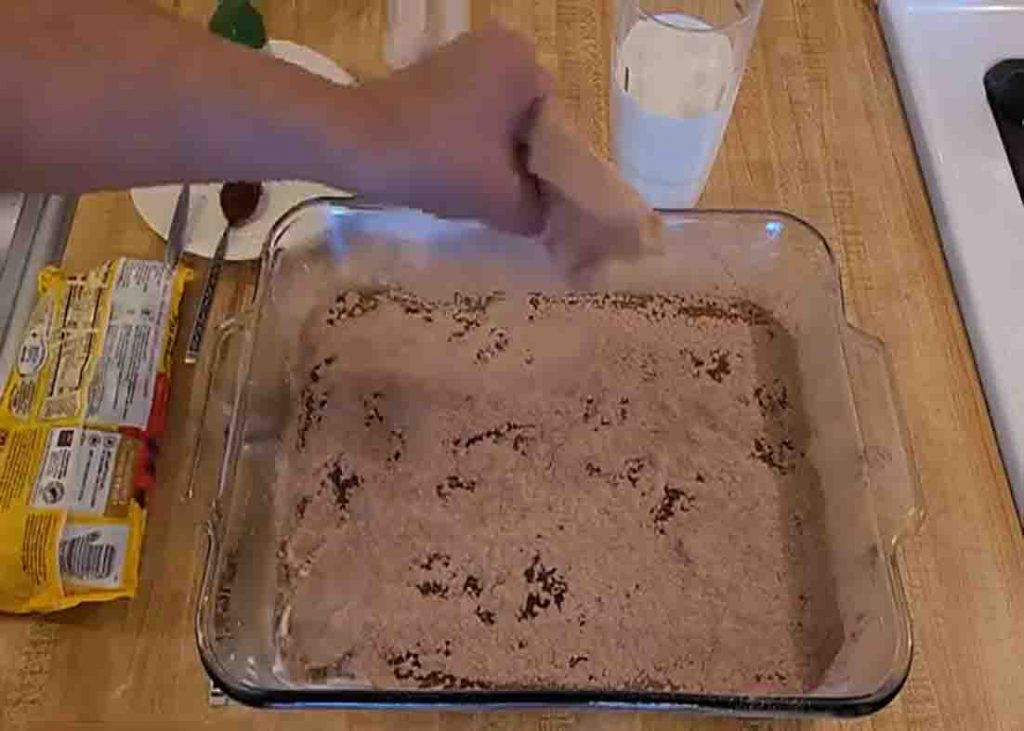 Assembling the chocolate dump cake