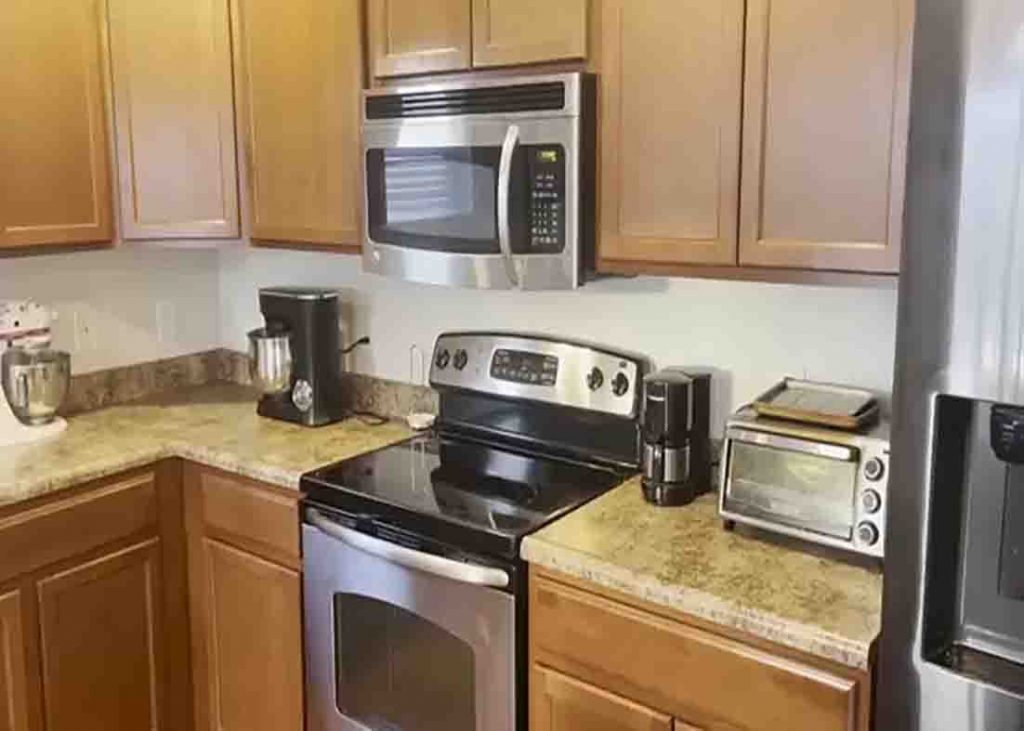 Having too much stuff on kitchen countertops could add a to the visual clutter