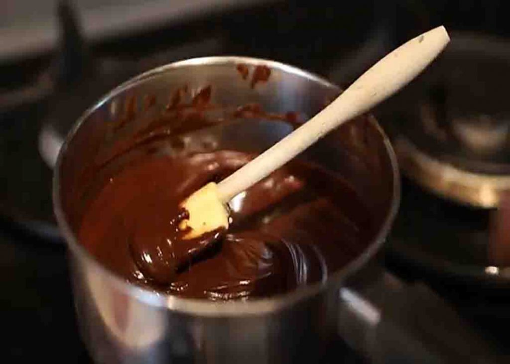 Melting the chocolate for the fudgy brownie cookie recipe