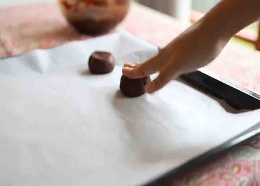 Placing the brownie cookie dough to the baking tray