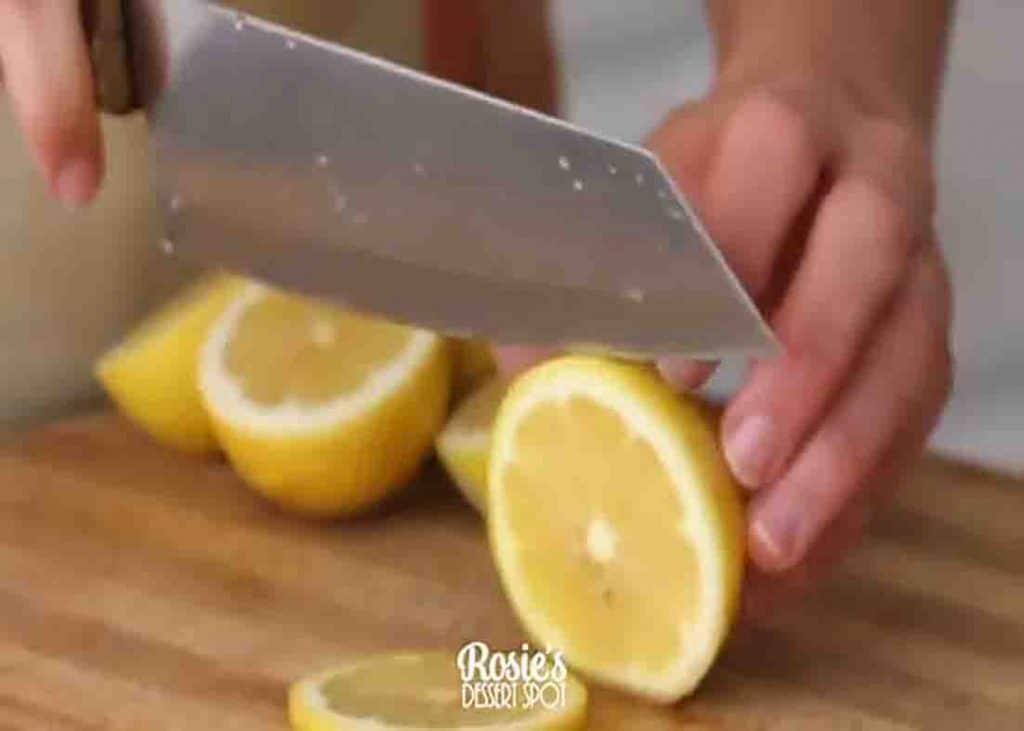 Slicing the lemons for the candied lemon slices recipe