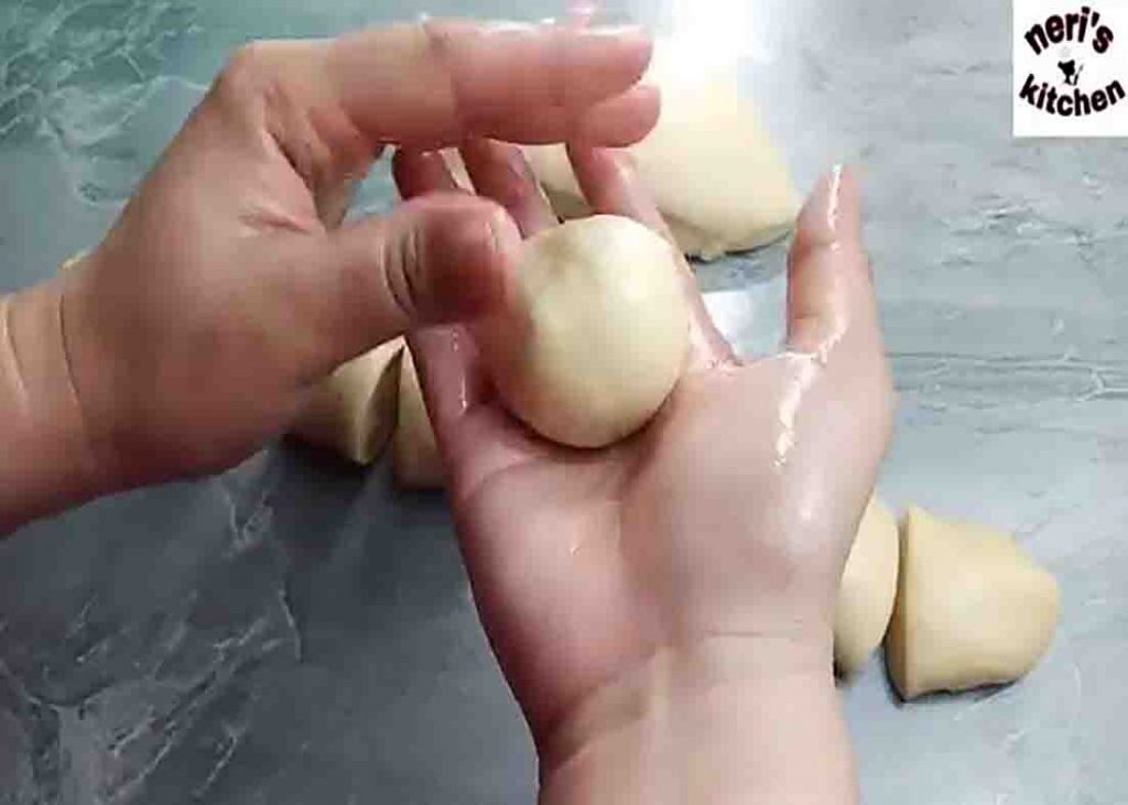 Making the cheesy donut balls