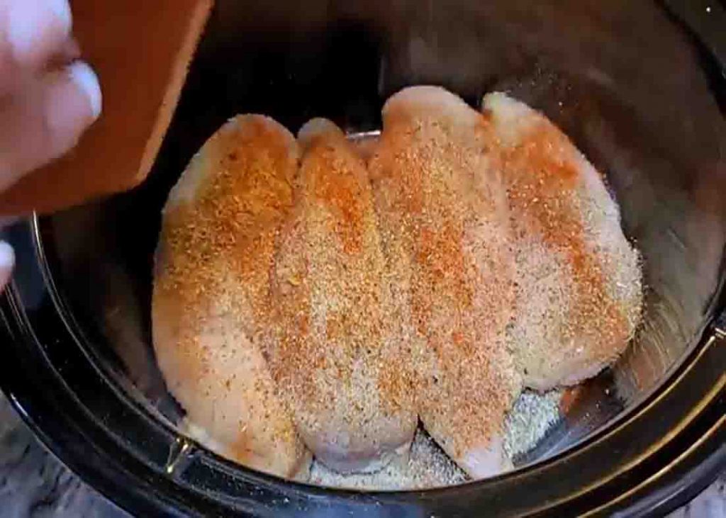 Seasoning the chicken breast for the mar me chicken pasta recipe