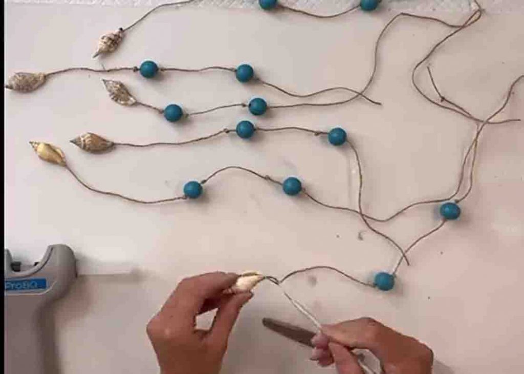 Make the bead and shell strands for the sandcastle wind chime