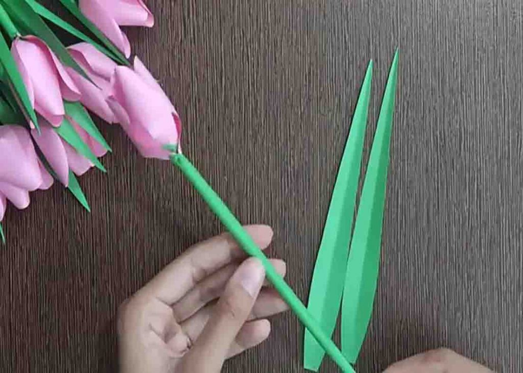 Attaching the leaves on the paper tulips
