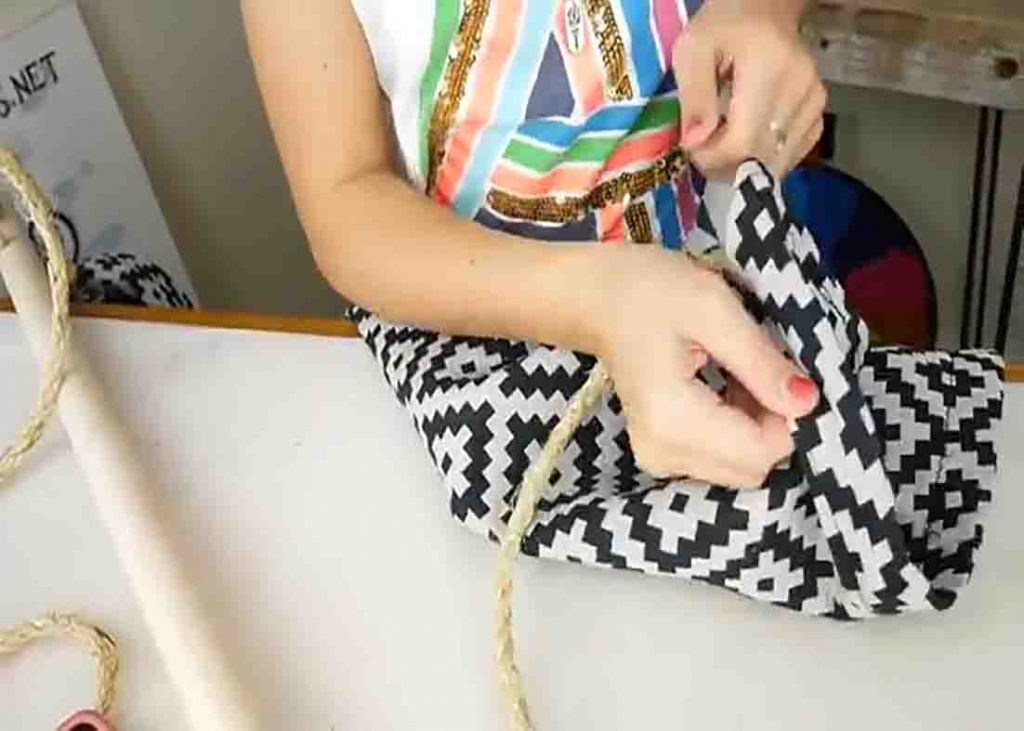 Attaching the rope to the DIY indoor hanging chair