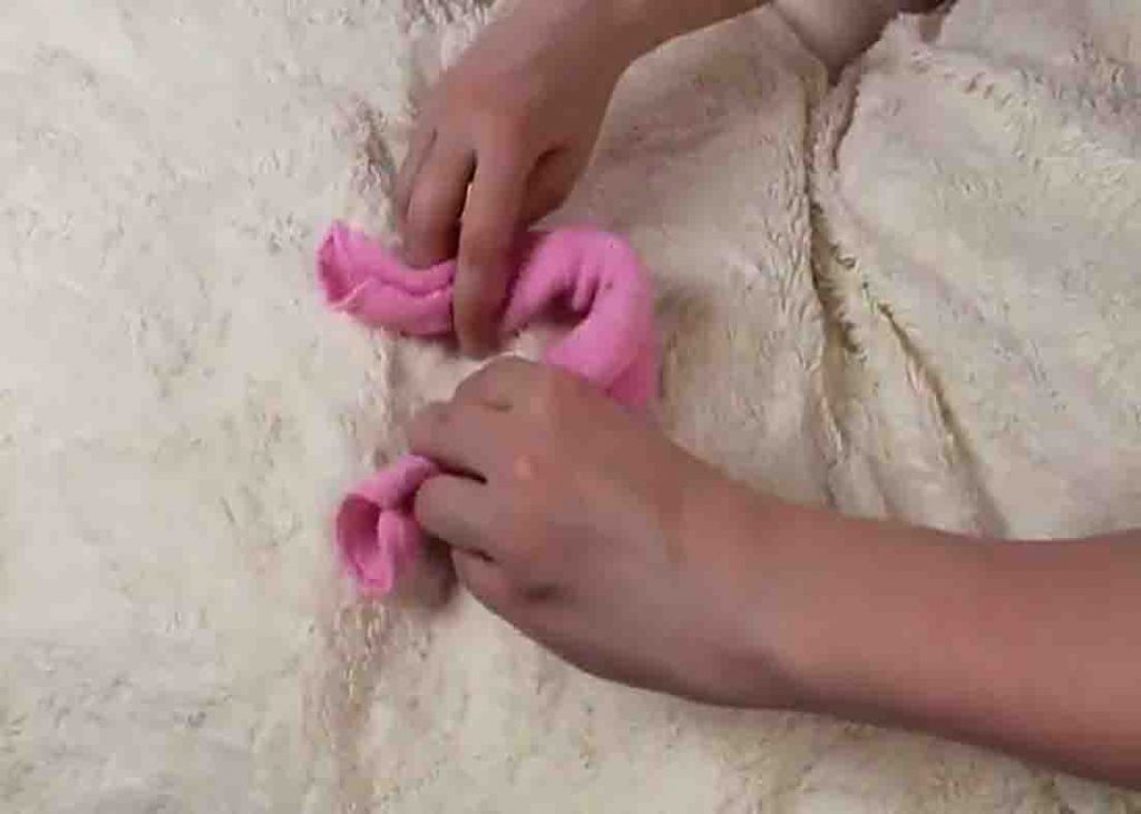Rolling the washcloth to make the bunny