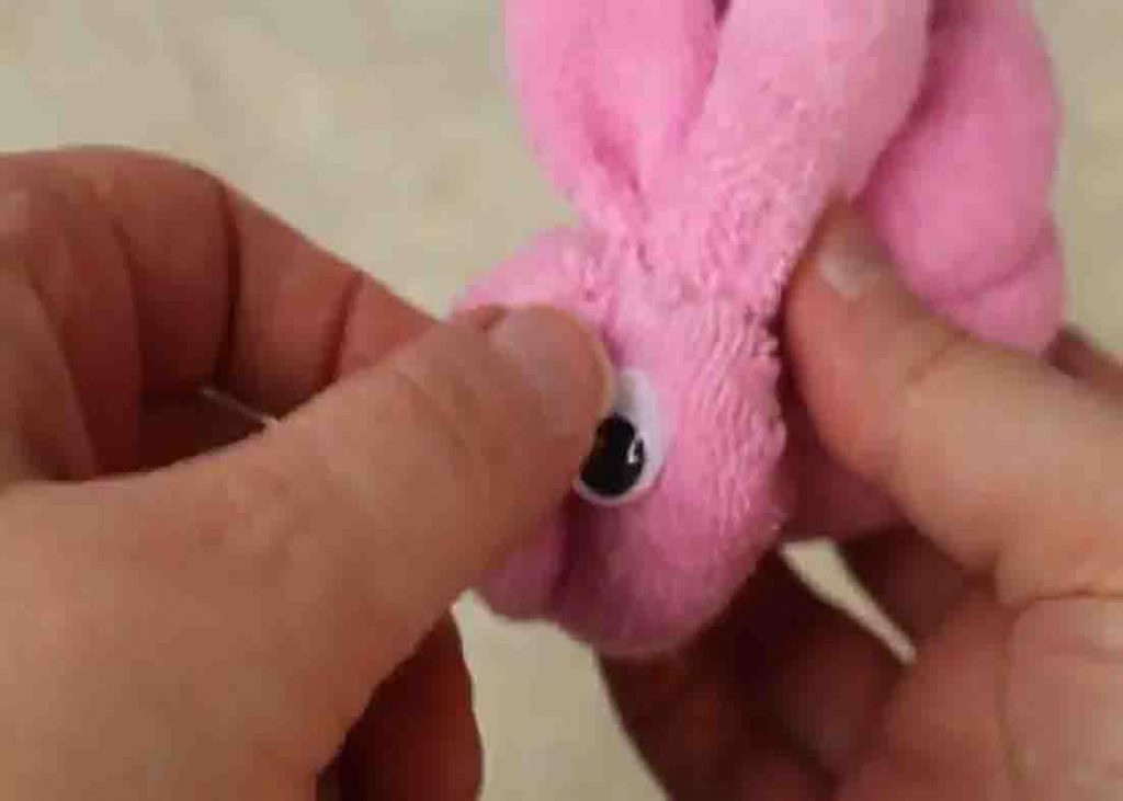 Attaching the googly eyes to the washcloth bunnies