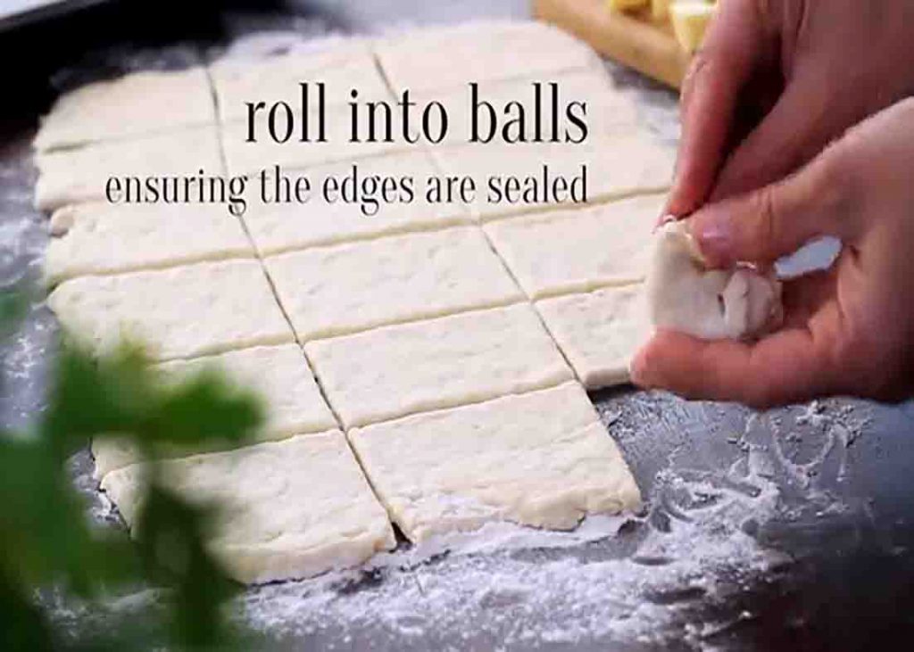 Dividing the dough to make the garlic cheese bombs