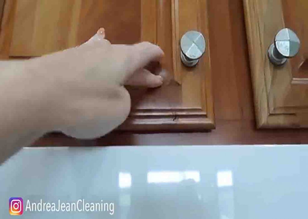 Dusting the cabinets first before removing the grease