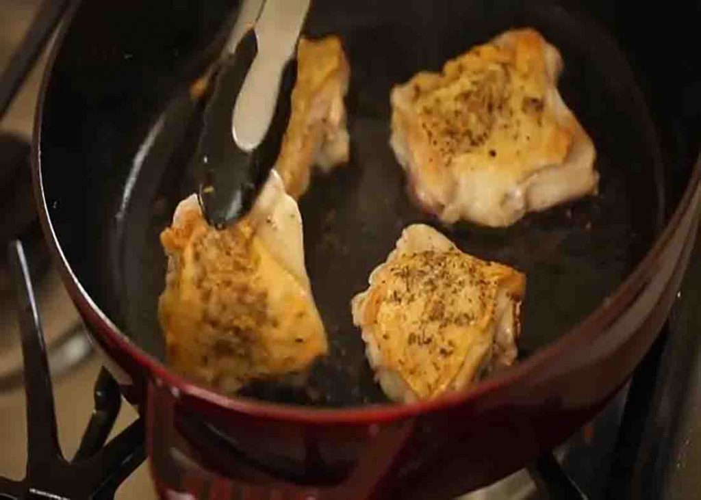 Searing the chicken for the one-pot chicken and potatoes recipe