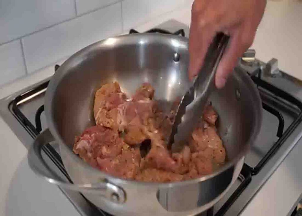 Searing the chicken for the one-pot creamy garlic mushroom pasta