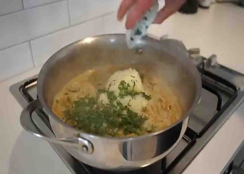 Seasoning the creamy garlic mushroom chicken pasta