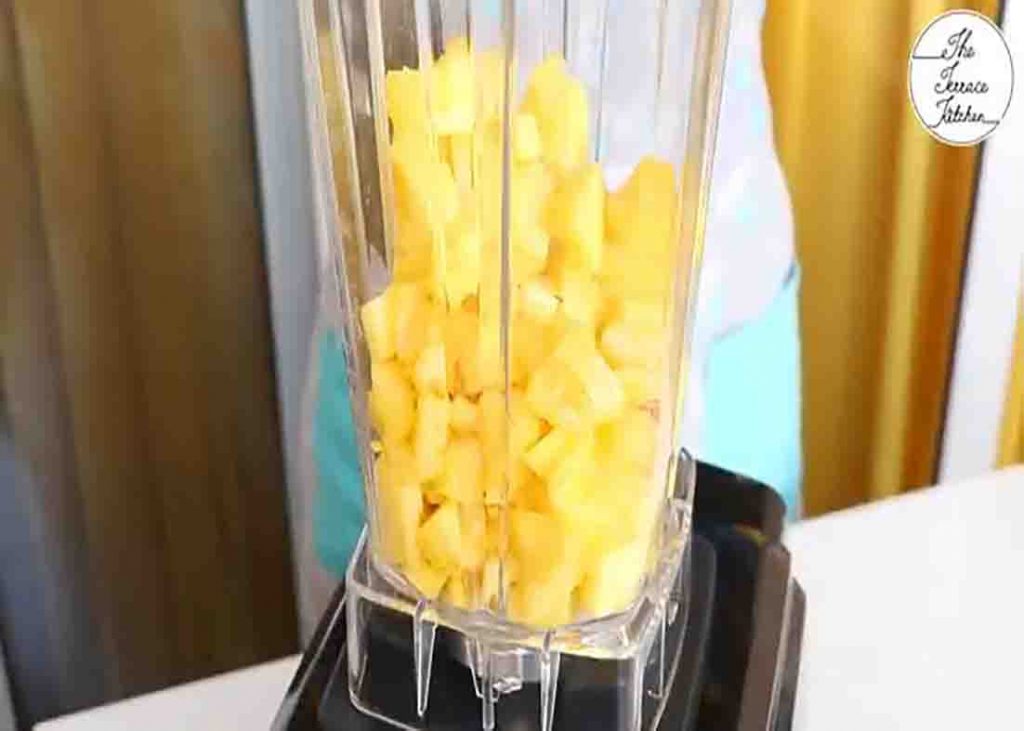 Blending the pineapple to make pineapple jam