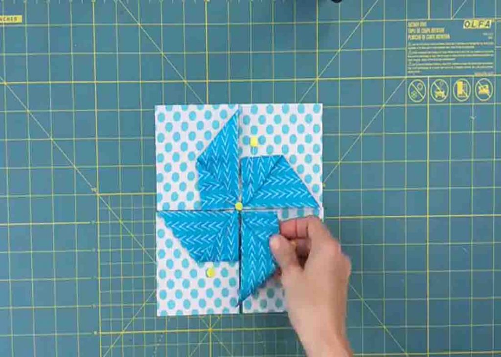 Assembling the first origami quilt block