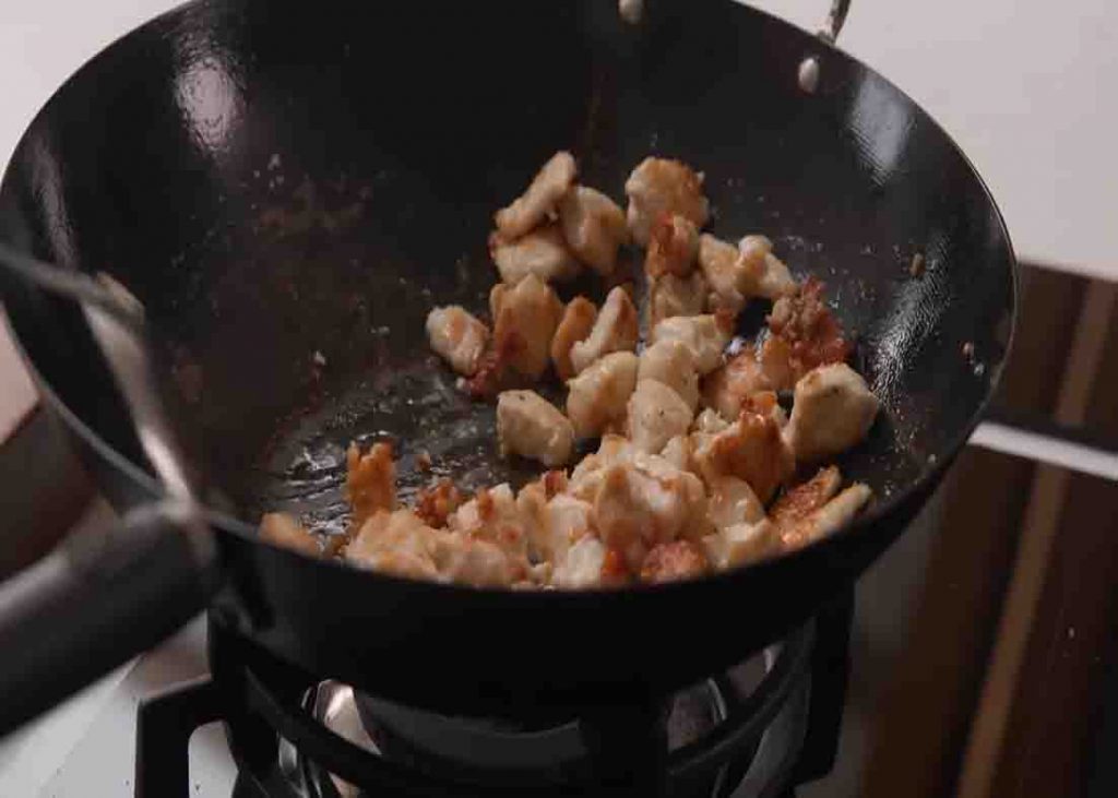 Frying the chicken for the sticky pineapple chicken recipe