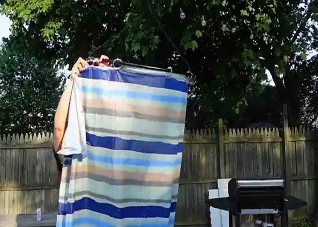 Making a DIY outdoor shower for rinsing after pool day