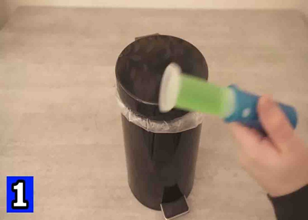 Sticking a toilet freshener to the trash bin lid