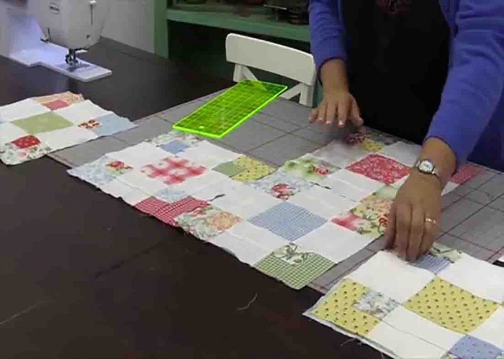 Laying the blocks down to complete the 9-patch swap quilt