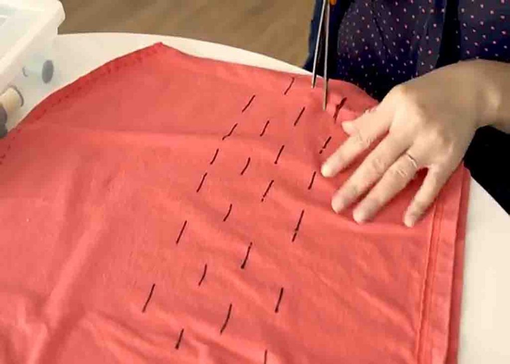 Cutting the slits to make holes on the DIY grocery bag