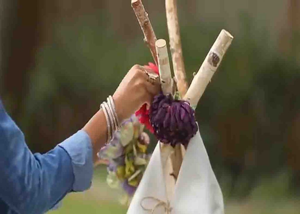 Attaching the florals on top of the teepee tent