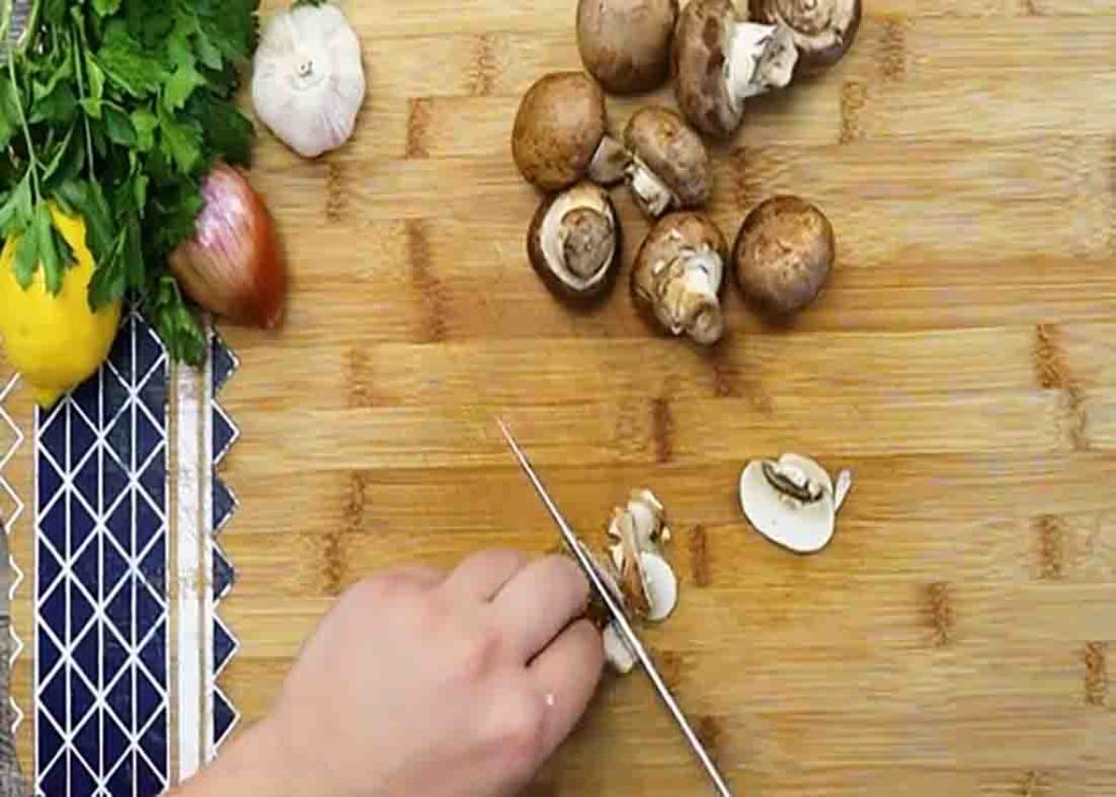 Slicing the mushrooms for the chicken scallopini