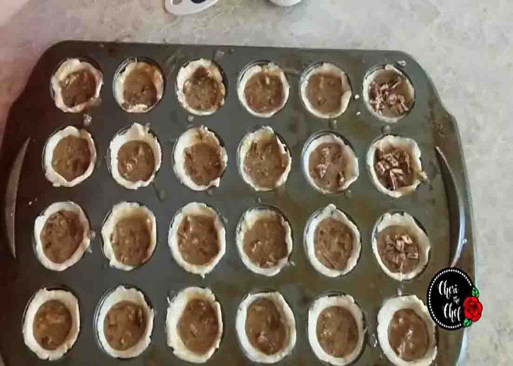 Assembling the pecan pie tarts
