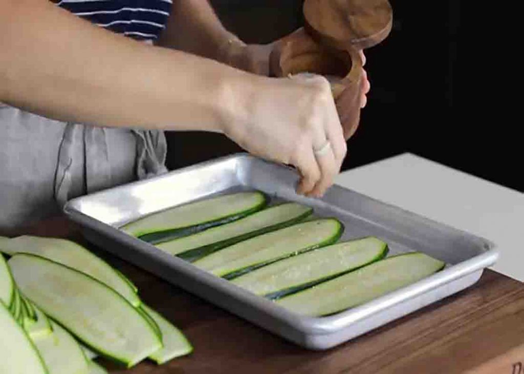 Salting the zucchini to remove the water