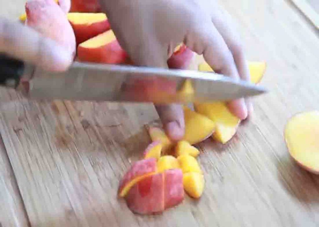 Chopping the peaches for the peach lemonade recipe