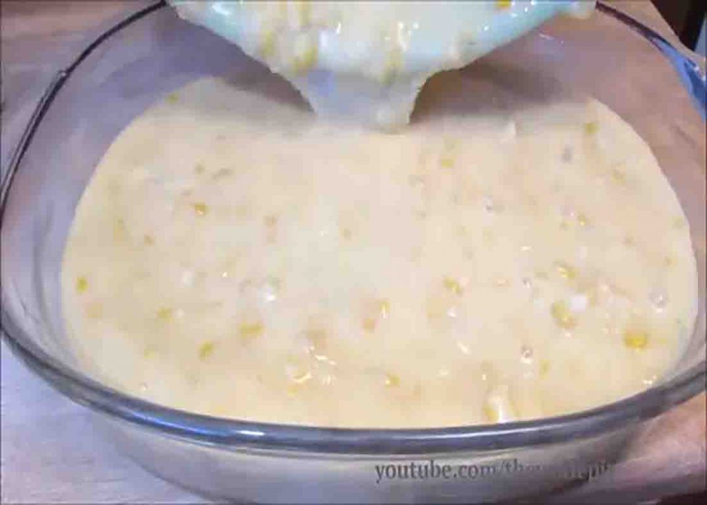 Pouring the corn pudding batter to the casserole