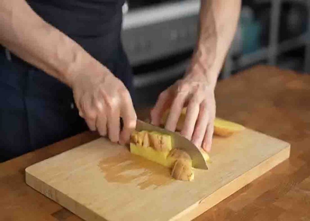 Chopping the potatoes for the breakfast hash recipe