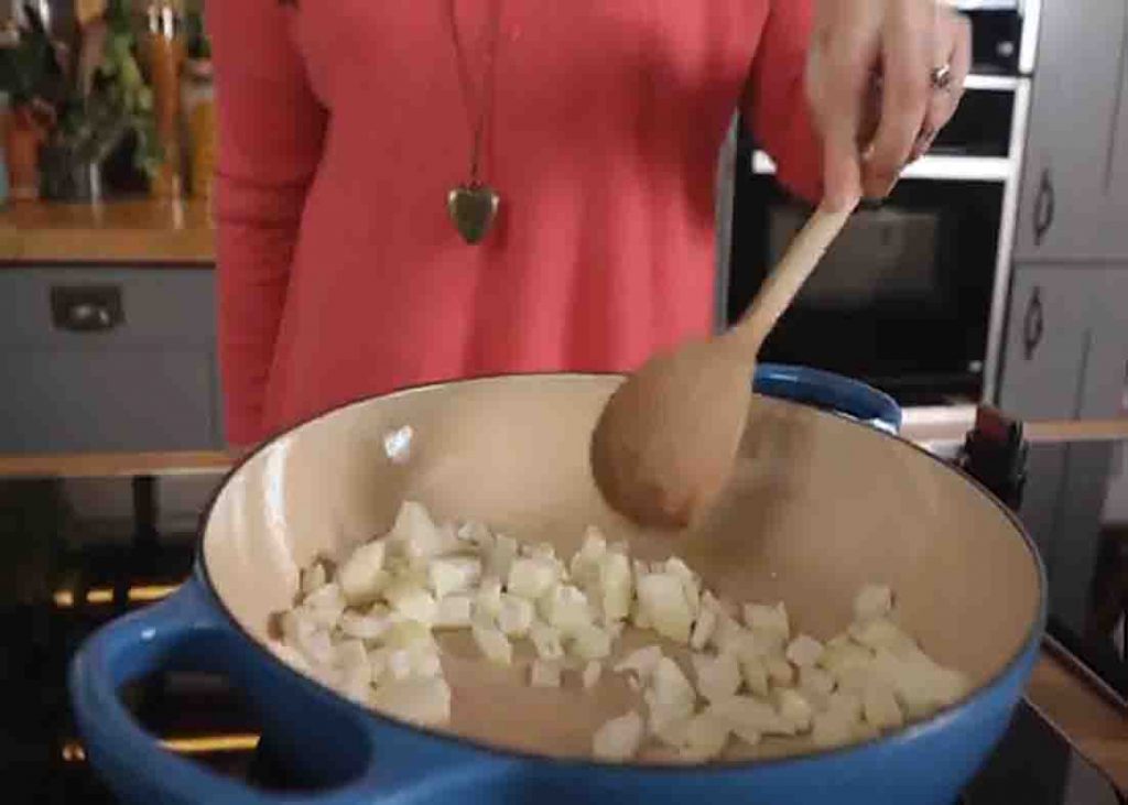 Sauteing the onion for the cajun chicken pasta recipe