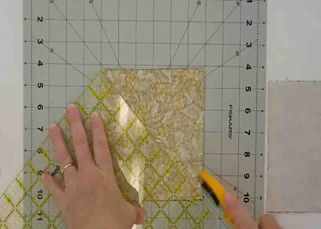 Cutting the fabric squares to make the quilted table runner