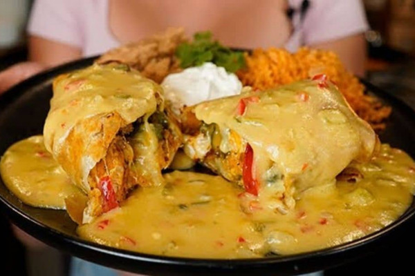 Cheesy Chicken Chimichangas With Green Chile Queso Sauce