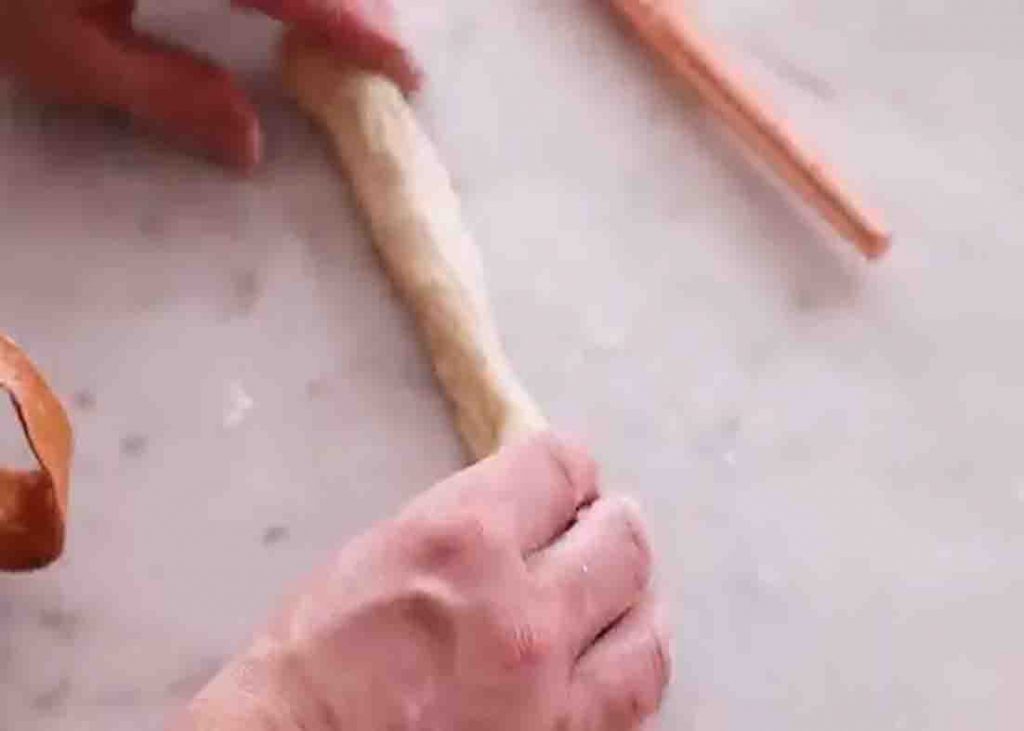 Rolling the dough into breadsticks