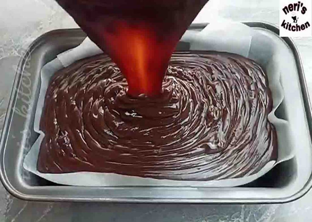 Transferring the chocolate pudding mixture to the baking dish