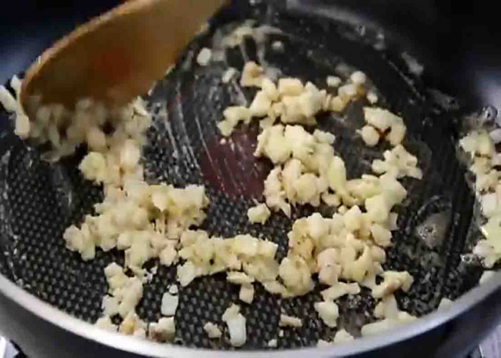 Sauteing the garlic and onion for the tuna pie recipe