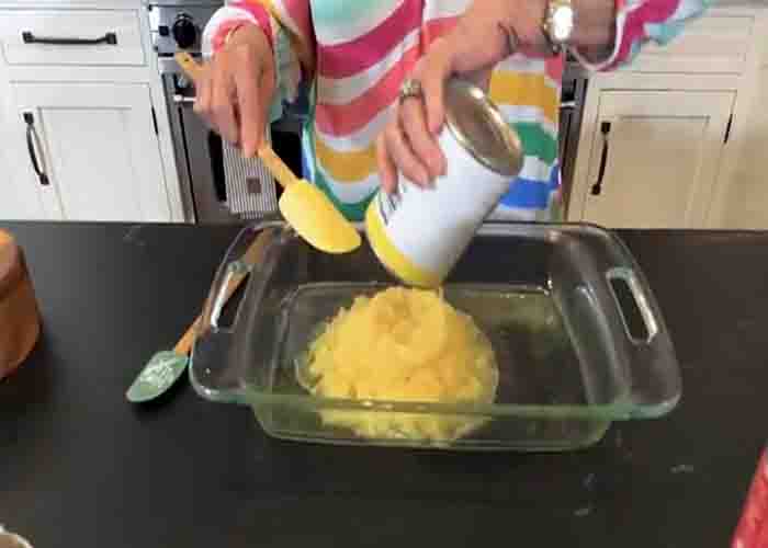 Spreading the pineapple on the bottom of the casserole dish