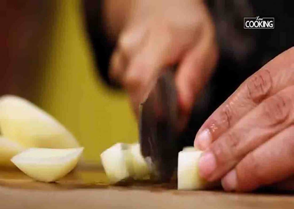 Chopping the potatoes into strips