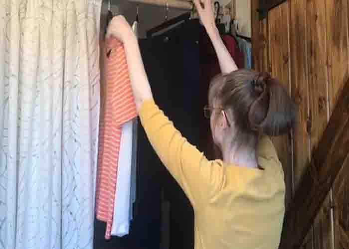 Hanging the clothes individually to avoid wrinkling